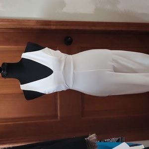 White jumpsuit with criss-cross on back.